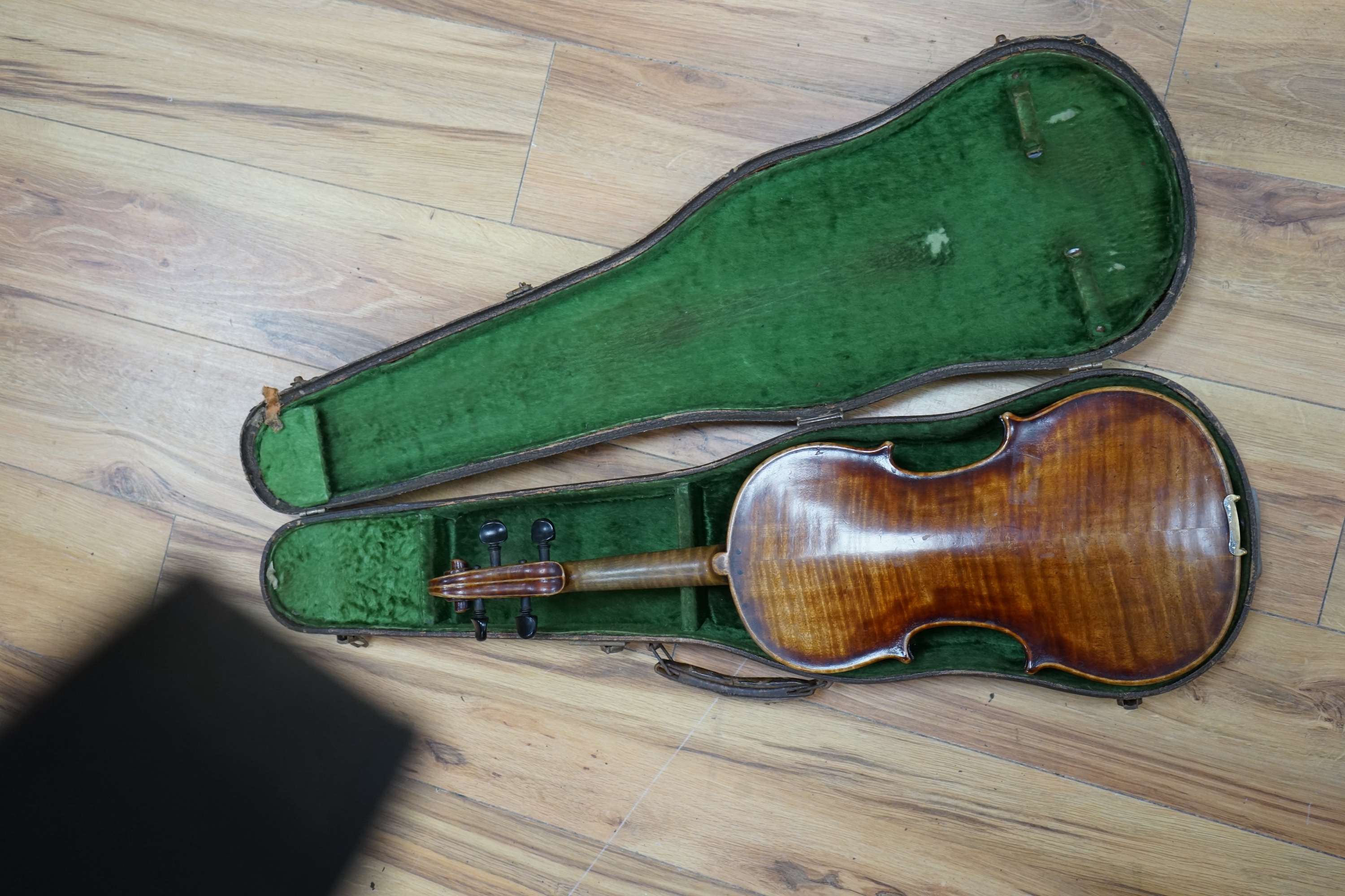 A cased 19th century English violin, with label reading George Craske, Fecit 1842, Edward Crompton, 54, Barton Arcade, Deansgate, Manchester, body length 36cm. Condition - fair to good.